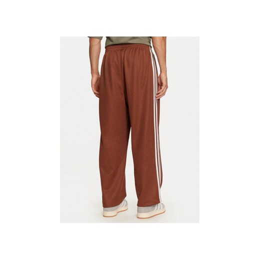 adidas Spodnie dresowe adicolor Firebird IZ2476 Brązowy Baggy Fit M MODIVO