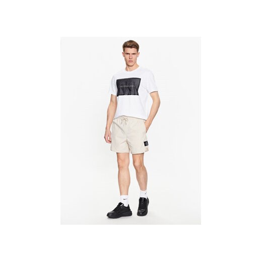 Calvin Klein Jeans Szorty sportowe J30J322904 Beżowy Regular Fit XS MODIVO