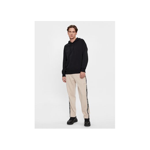 Calvin Klein Jeans Spodnie dresowe Logo Tape J30J324376 Beżowy Relaxed Fit M MODIVO
