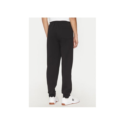 Champion Spodnie dresowe 220434 Czarny Loose Fit Champion M MODIVO