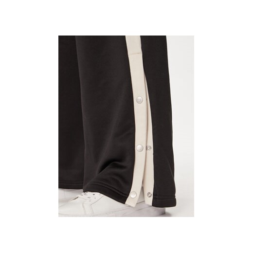 Puma Spodnie dresowe T7 For The Fanbase 625025 Czarny Relaxed Fit Puma S MODIVO