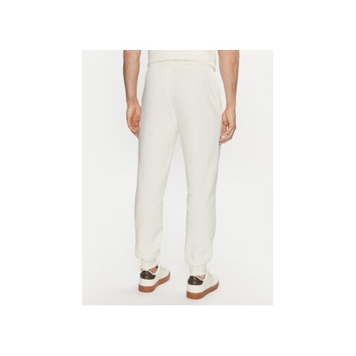 Calvin Klein Jeans Spodnie dresowe Monologo Hwk Pant J30J325658 Écru Regular Fit S MODIVO