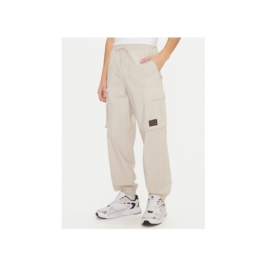 Champion Spodnie dresowe 220415 Écru Loose Fit ze sklepu MODIVO w kategorii Spodnie męskie - zdjęcie 177285688