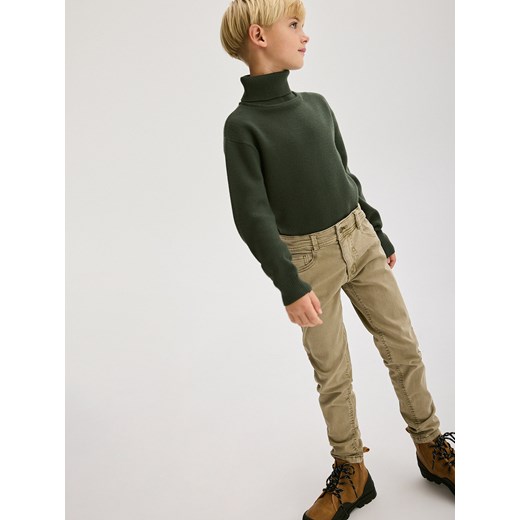 Reserved - Elastyczne spodnie slim - beżowy Reserved 128 (7-8 lat) promocyjna cena Reserved