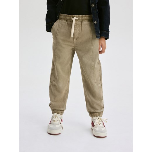 Reserved - Elastyczne jeansy jogger - beżowy Reserved 158 (12 lat) Reserved wyprzedaż
