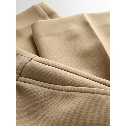 Reserved - Spodnie flare z kantem - beżowy Reserved XL Reserved