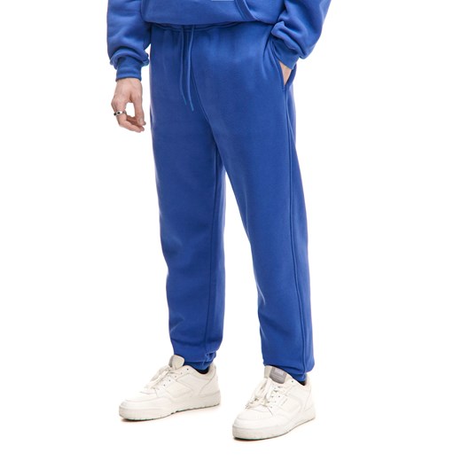 Cropp - Niebieskie dresowe joggery regular - niebieski ze sklepu Cropp w kategorii Spodnie męskie - zdjęcie 177588718