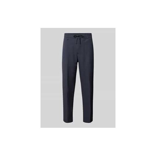 Spodnie materiałowe o kroju regular fit z tunelem model ‘Convert’ ze sklepu Peek&Cloppenburg  w kategorii Spodnie męskie - zdjęcie 177808038