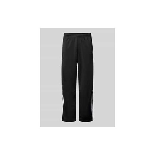 Spodnie treningowe o kroju regular fit z listwami na zatrzaski model ‘ADIBREAK’ ze sklepu Peek&Cloppenburg  w kategorii Spodnie męskie - zdjęcie 177824178
