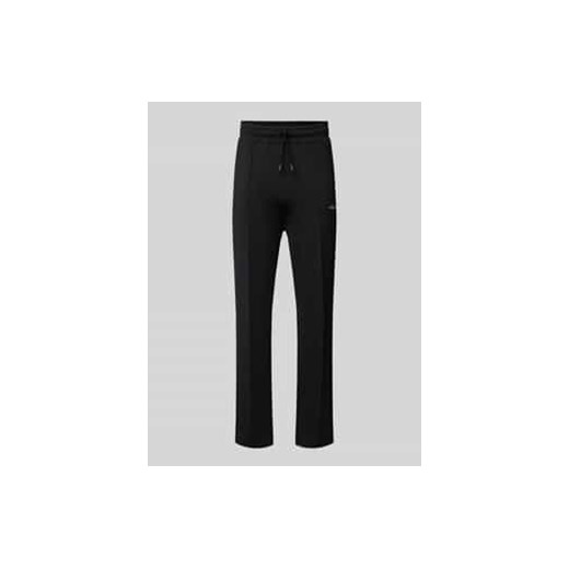 Spodnie typu track pants z elastycznym pasem i wyhaftowanym logo ze sklepu Peek&Cloppenburg  w kategorii Spodnie męskie - zdjęcie 177832597