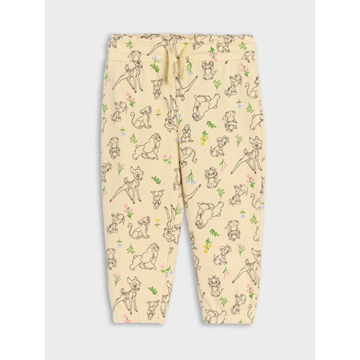 Sinsay - Spodnie dresowe Disney - kremowy Sinsay 86 Sinsay