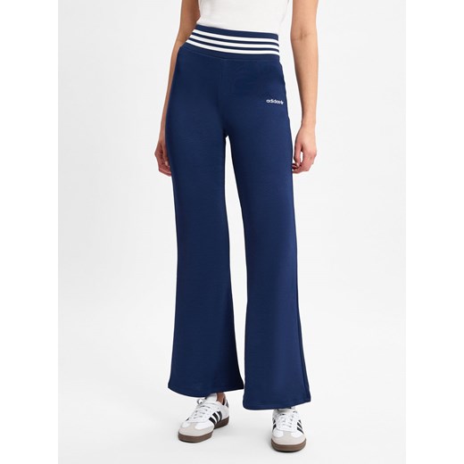 adidas Originals Spodnie do biegania adidas dla kobiet - Rozkloszowane spodnie Kobiety granatowy jednolity ze sklepu vangraaf w kategorii Spodnie damskie - zdjęcie 178316359