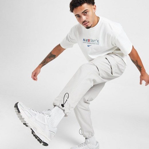 NIKE SPODNIE PLAYER WVN PANT LT ORE PANTS Nike L JD Sports wyprzedaż