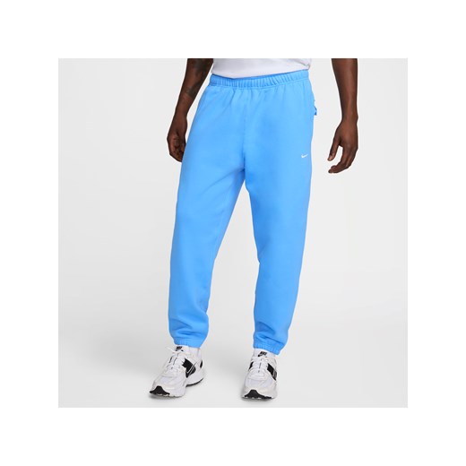 Męskie spodnie z dzianiny Nike Solo Swoosh - Niebieski ze sklepu Nike poland w kategorii Spodnie męskie - zdjęcie 178602185