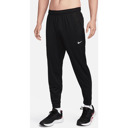 Męskie uniwersalne spodnie ze zwężanymi nogawkami Dri-FIT Nike Totality - Czerń ze sklepu Nike poland w kategorii Spodnie męskie - zdjęcie 178602447
