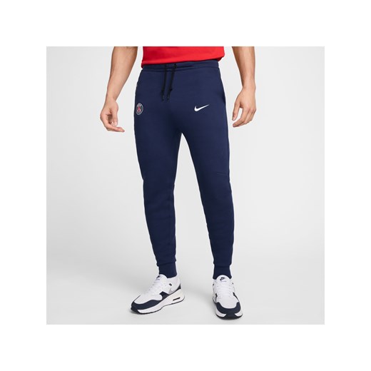 Męskie joggery piłkarskie Nike Paris Saint-Germain Tech Fleece - Niebieski ze sklepu Nike poland w kategorii Spodnie męskie - zdjęcie 178604565