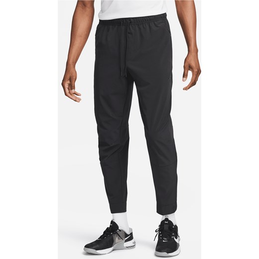 Męskie uniwersalne spodnie ze ściągaczami i zamkami Dri-FIT Nike Unlimited - Czerń ze sklepu Nike poland w kategorii Spodnie męskie - zdjęcie 178606919