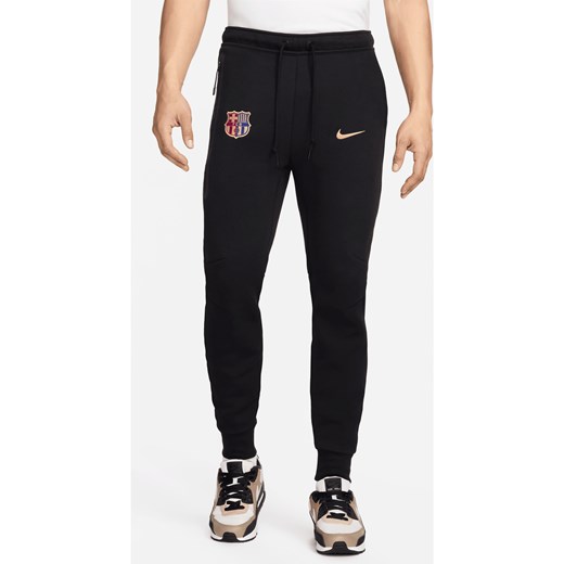 Męskie joggery piłkarskie Nike FC Barcelona Tech Fleece - Czerń ze sklepu Nike poland w kategorii Spodnie męskie - zdjęcie 178607765