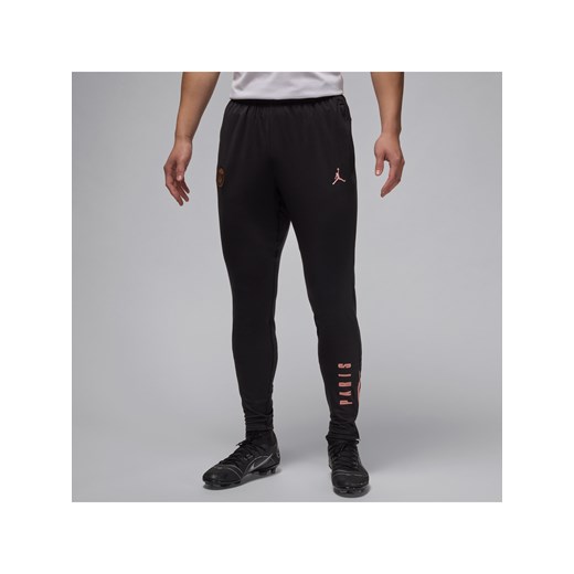 Męskie spodnie piłkarskie Jordan Dri-FIT Paris Saint-Germain Strike (wersja trzecia) - Czerń ze sklepu Nike poland w kategorii Spodnie męskie - zdjęcie 178609235