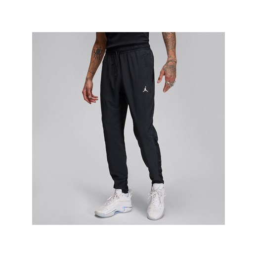 Męskie spodnie z tkaniny Dri-FIT Jordan Sport - Czerń ze sklepu Nike poland w kategorii Spodnie męskie - zdjęcie 178609828