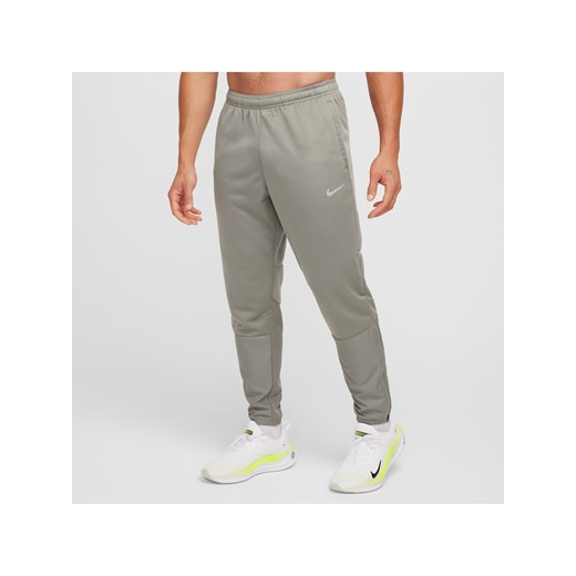 Męskie wodoodporne spodnie do biegania Therma-FIT Nike Sphere Challenger - Szary ze sklepu Nike poland w kategorii Spodnie męskie - zdjęcie 178610026