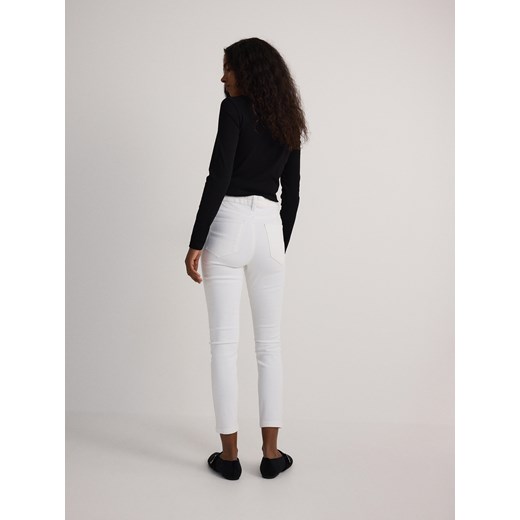 Reserved - Jeansy slim fit mid rise - biały Reserved 34 Reserved