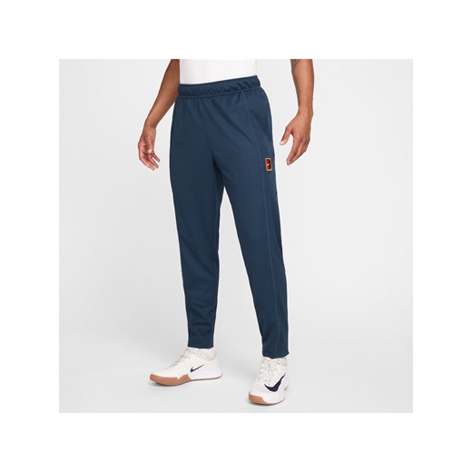 Męskie spodnie do tenisa NikeCourt Heritage - Niebieski ze sklepu Nike poland w kategorii Spodnie męskie - zdjęcie 179134066