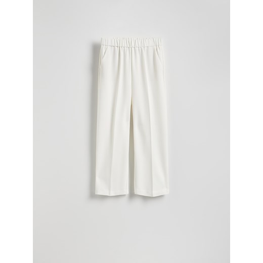 Reserved - Spodnie z kantem - złamana biel Reserved M Reserved