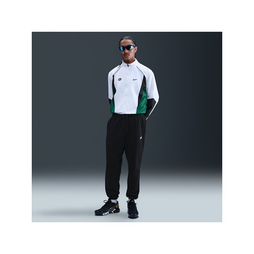 Męskie spodnie ze szczotkowanej dzianiny ze ściągaczami Nike Club - Czerń ze sklepu Nike poland w kategorii Spodnie męskie - zdjęcie 179442879