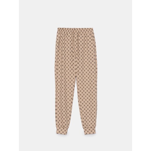 Mohito - Spodnie dresowe w monogram - beżowy ze sklepu Mohito w kategorii Spodnie damskie - zdjęcie 179714828