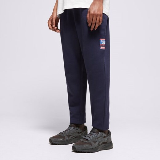 REEBOK SPODNIE RI BADGE ze sklepu Sizeer w kategorii Spodnie męskie - zdjęcie 179788476