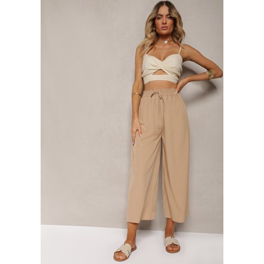 Beżowe Spodnie High Waist z Szerokimi Nogawkami z Wiskozą Wykończone Gumką w Talii Crisantas ze sklepu renee.pl w kategorii Spodnie damskie - zdjęcie 179909779