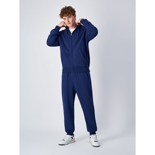 Champion Spodnie dresowe w kolorze granatowym Champion XL wyprzedaż Limango Polska