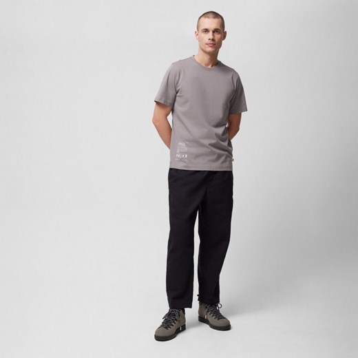 Męskie spodnie casual Outhorn OTHWSS24TTROM632 - czarne ze sklepu Sportstylestory.com w kategorii Spodnie męskie - zdjęcie 180374869