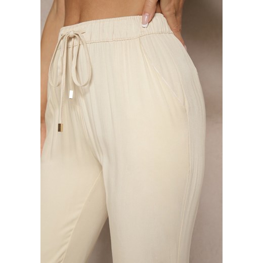 Jasnobeżowe Spodnie Dresowe High Waist z Ozdobnym Wiązaniem Ellivaria Renee L wyprzedaż renee.pl