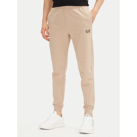 EA7 Emporio Armani Spodnie dresowe 8NPP66 PJVRZ U6155 Beżowy Slim Fit ze sklepu MODIVO w kategorii Spodnie męskie - zdjęcie 181162169