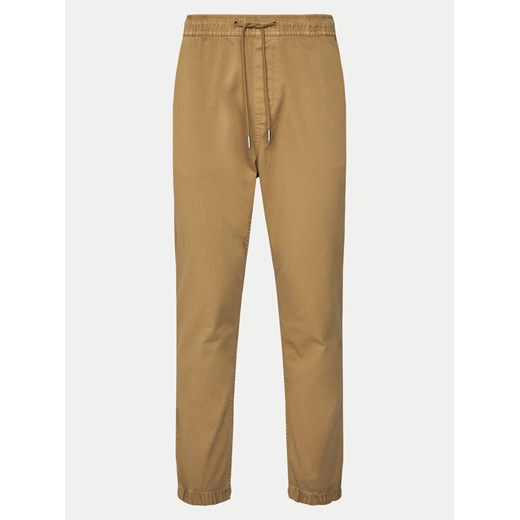 Tommy Jeans Joggery Austin DM0DM20283 Beżowy Slim Fit ze sklepu MODIVO w kategorii Spodnie męskie - zdjęcie 181177895