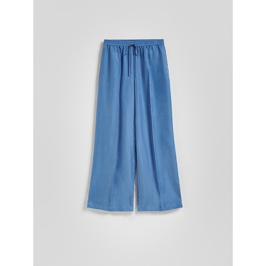 Reserved - Spodnie z tkaniną cupro - jasnoniebieski Reserved M Reserved