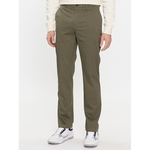 Tommy Hilfiger Chinosy Denton MW0MW33938 Khaki Slim Fit ze sklepu MODIVO w kategorii Spodnie męskie - zdjęcie 182595109