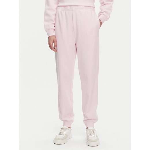 Tommy Hilfiger Spodnie dresowe WW0WW45576 Różowy Regular Fit ze sklepu MODIVO w kategorii Spodnie damskie - zdjęcie 182596567