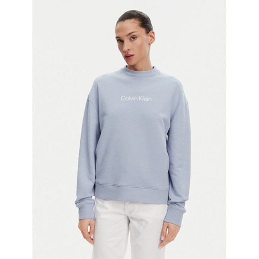 Calvin Klein Bluza Hero Logo K20K205450 Błękitny Regular Fit ze sklepu MODIVO w kategorii Bluzy damskie - zdjęcie 182596696