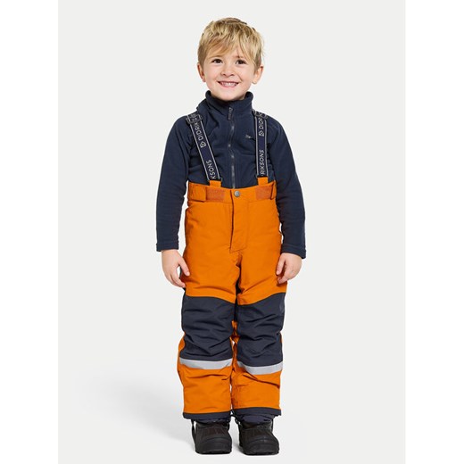 Didriksons Spodnie zimowe Idre 504357 Pomarańczowy Regular Fit ze sklepu MODIVO w kategorii Spodnie chłopięce - zdjęcie 182596888