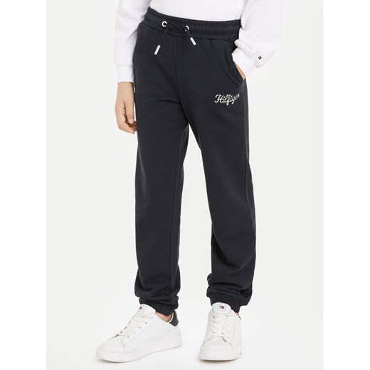 Tommy Hilfiger Spodnie dresowe NY KG0KG08108 Granatowy Regular Fit ze sklepu MODIVO w kategorii Spodnie chłopięce - zdjęcie 182597219