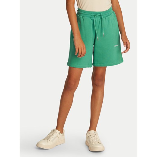 Calvin Klein Jeans Szorty sportowe New Inst. Logo IU0IU00703 Zielony Relaxed Fit ze sklepu MODIVO w kategorii Spodenki dziewczęce - zdjęcie 182597295