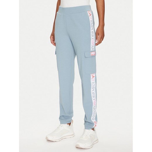 EA7 Emporio Armani Spodnie dresowe 3DTP64 TJKWZ 1533 Błękitny Regular Fit ze sklepu MODIVO w kategorii Spodnie damskie - zdjęcie 182597366