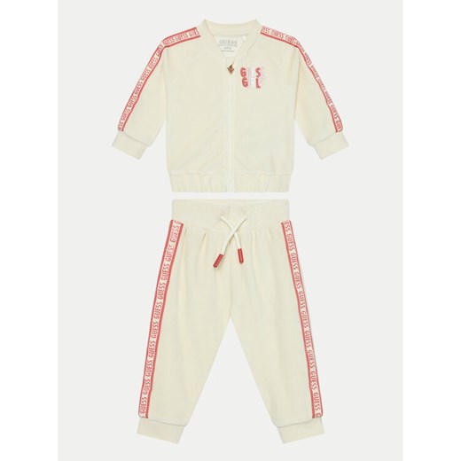 Guess Dres A4BG09 KAVN4 Beżowy Regular Fit ze sklepu MODIVO w kategorii Dresy dla niemowlaka - zdjęcie 182598009