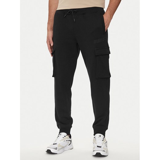 Guess Spodnie dresowe Aldwin Z4YB08 KAIJ1 Czarny Regular Fit ze sklepu MODIVO w kategorii Spodnie męskie - zdjęcie 182600519