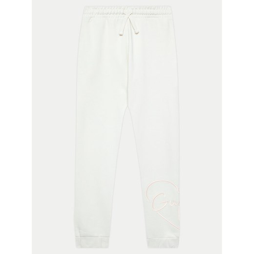 Guess Spodnie dresowe J4YQ16 KA6R3 Biały Relaxed Fit ze sklepu MODIVO w kategorii Spodnie chłopięce - zdjęcie 182600977