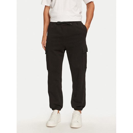 Jack&Jones Spodnie dresowe Kane 12263074 Czarny Relaxed Fit ze sklepu MODIVO w kategorii Spodnie męskie - zdjęcie 182601685