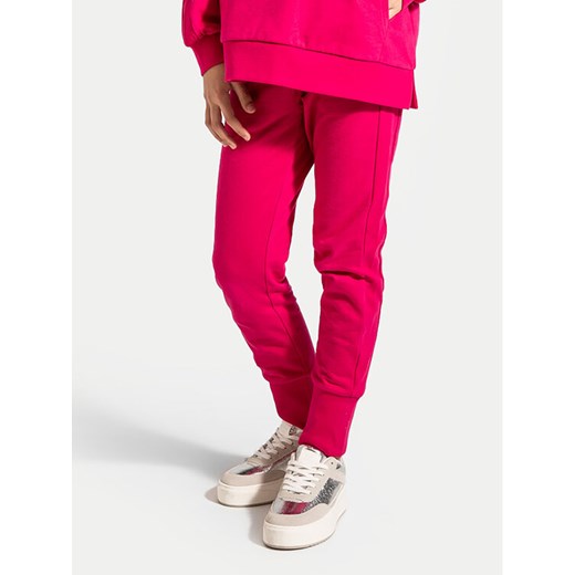 Coccodrillo Spodnie dresowe ZC4120201VGA Różowy Slim Fit ze sklepu MODIVO w kategorii Spodnie dziewczęce - zdjęcie 182604276